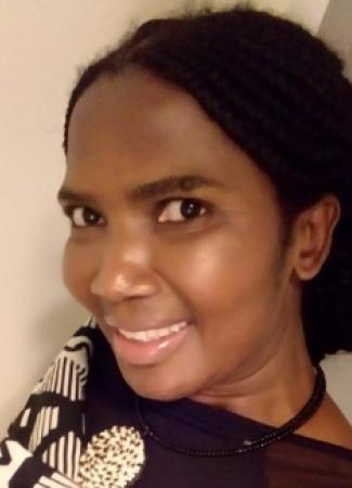 A headshot of Audrey Mbeje